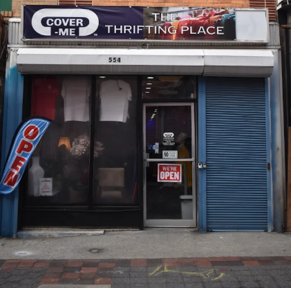 The COVER-ME: The Thrifting Place storefront at 554 Old Town Mall, with the We're Open sign in the door.